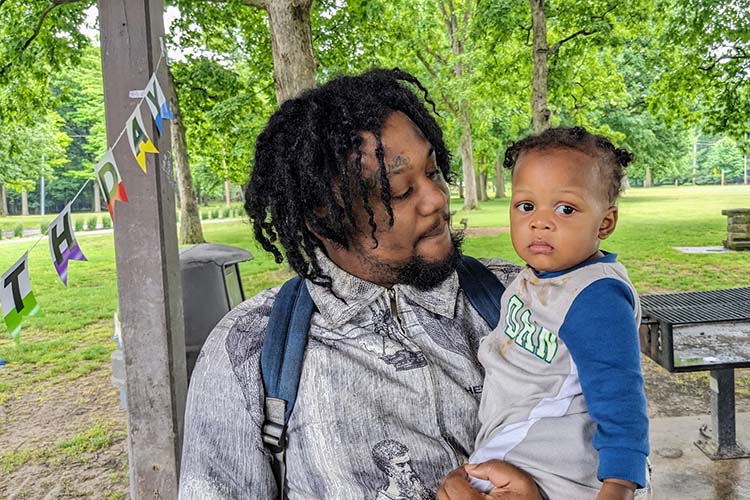 Isaiah Brown celebrates his son Nysere's first birthday at Garfield Park Reservation